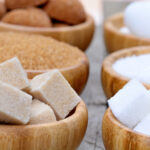 The image displays various types of sugar, including granulated, powdered, white, and brown sugars.
