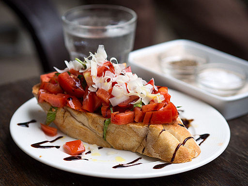 The image shows a Bruschetta on a dish