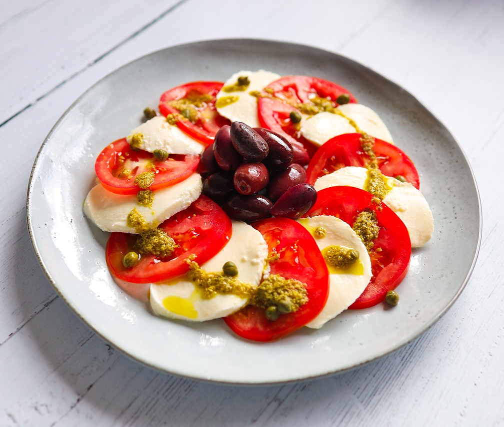 The image shows Caprese Salad on the dish