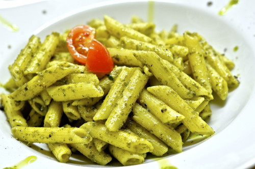 The image shows a bowl of Pesto penne pasta