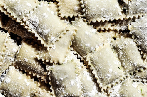 The picture shows a pile of Ravioli pasta
