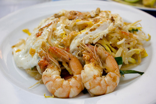 The image presents Shrimp Pad Thai on the white dish